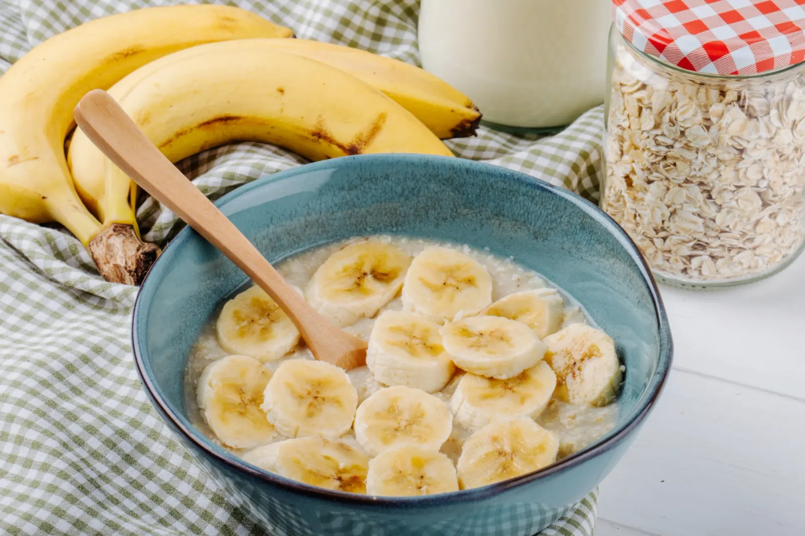Bowl of oatmeal porridge topped with sliced banana