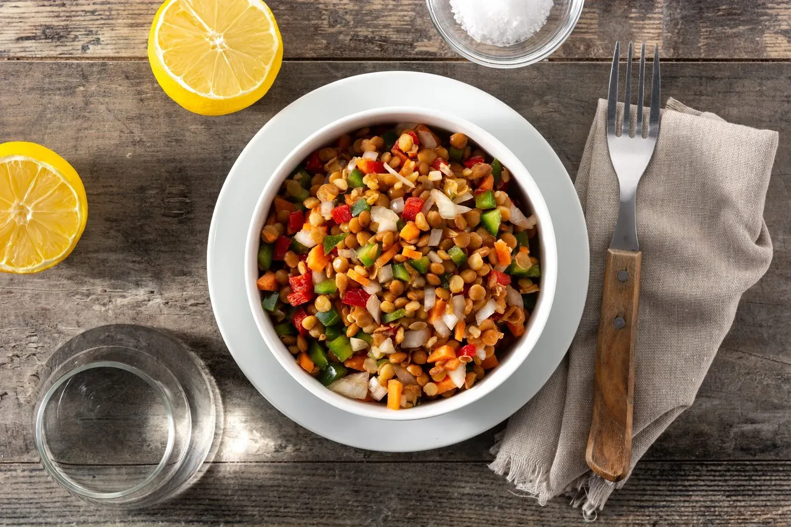 Lentil salad with peppers, onion and carrot in a bowl