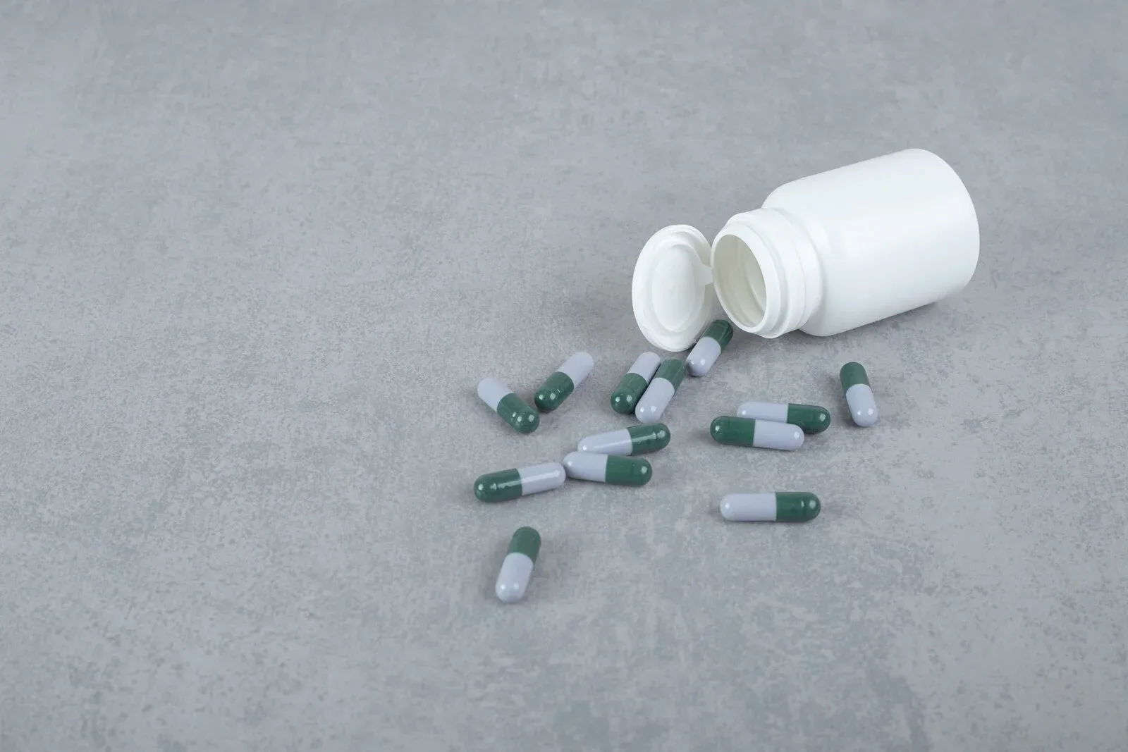 A small jar of magnesium supplement capsules