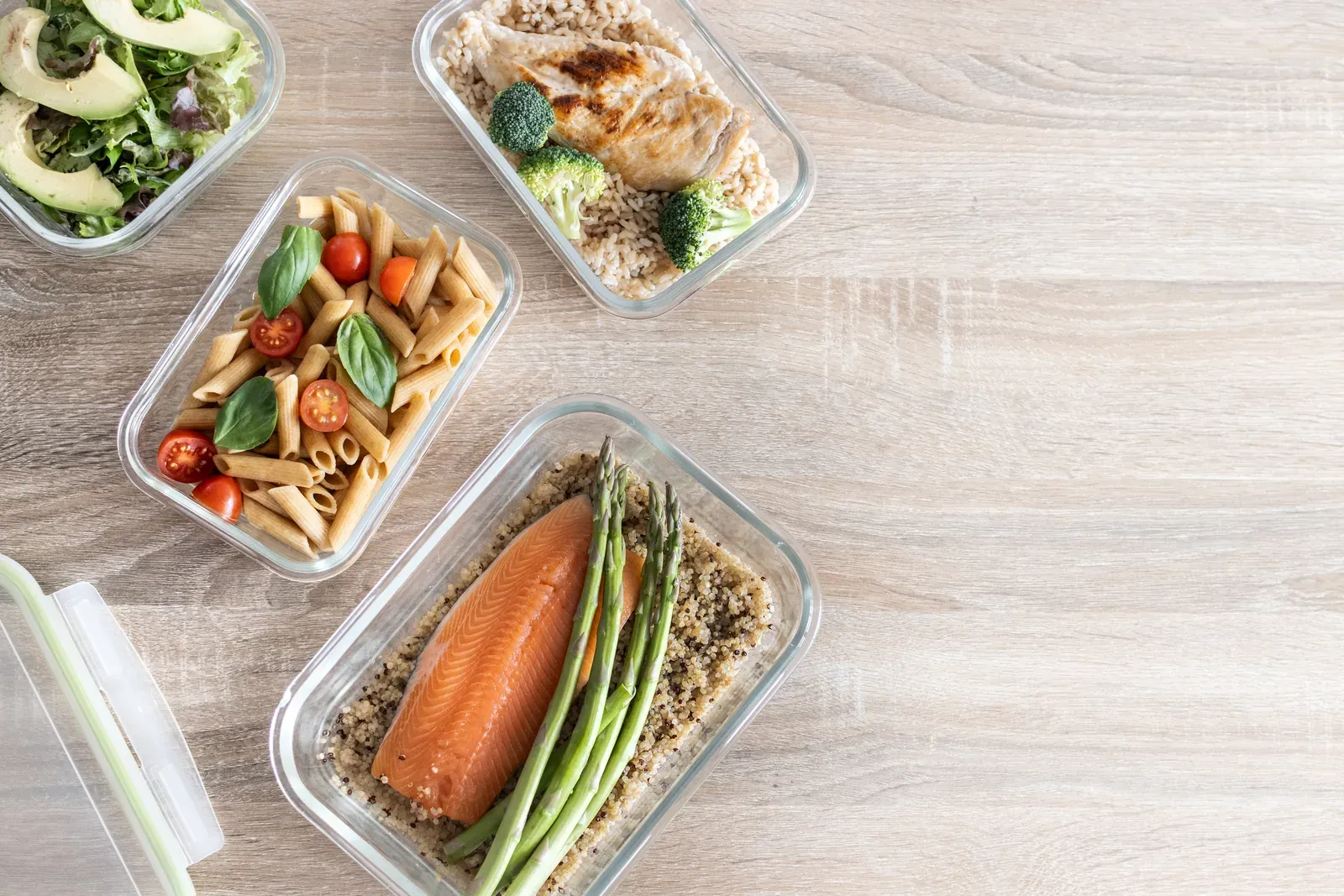 Weekly meal prep containers filled with wholegrains, vegetables and lean protein